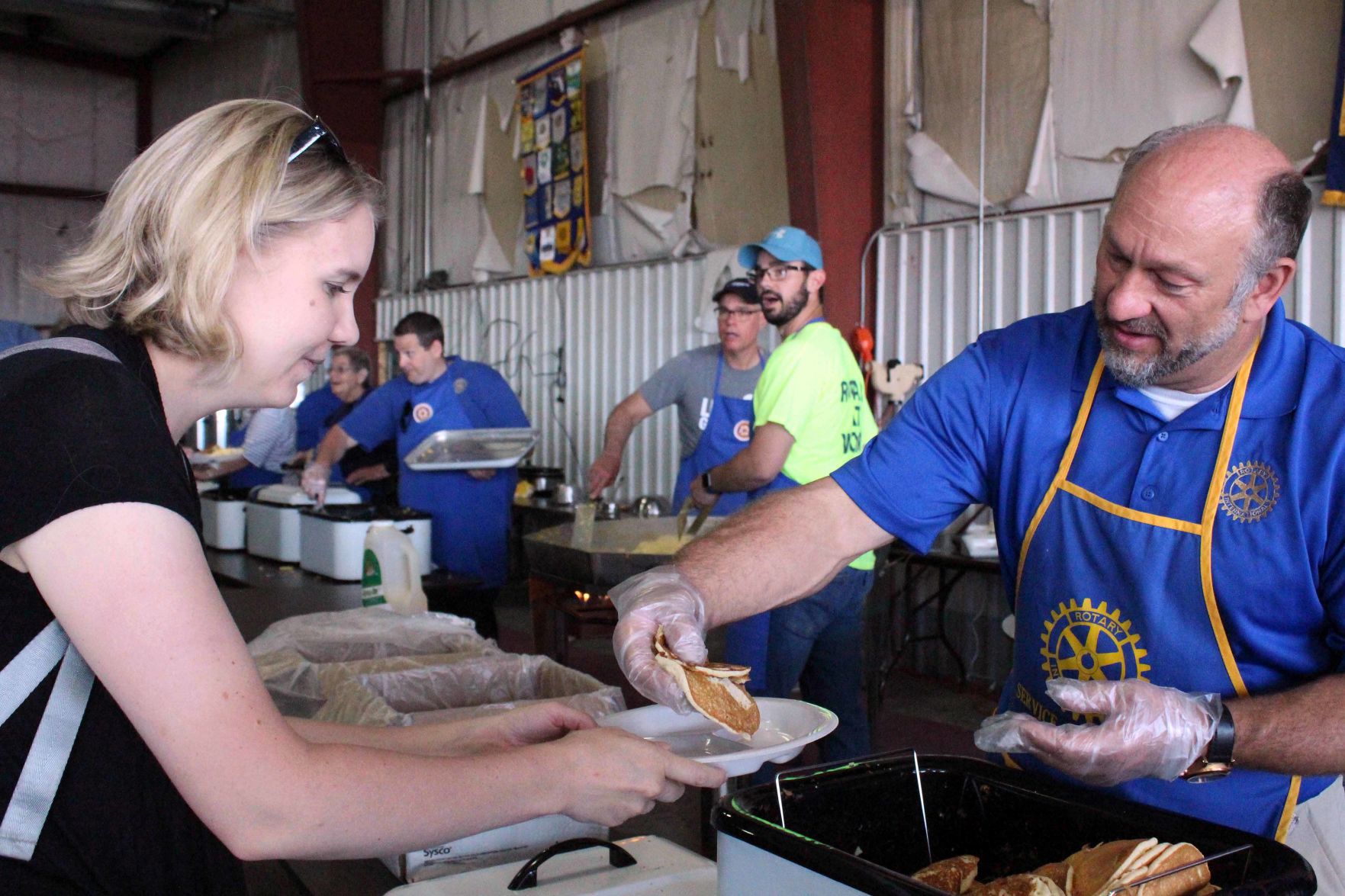 Mike serves Heather